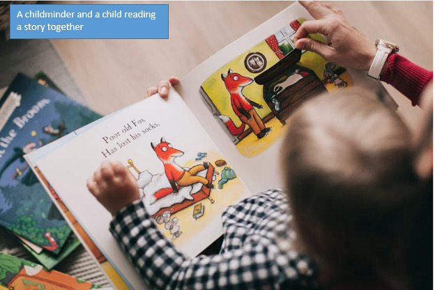 a childminder and a child reading a story together